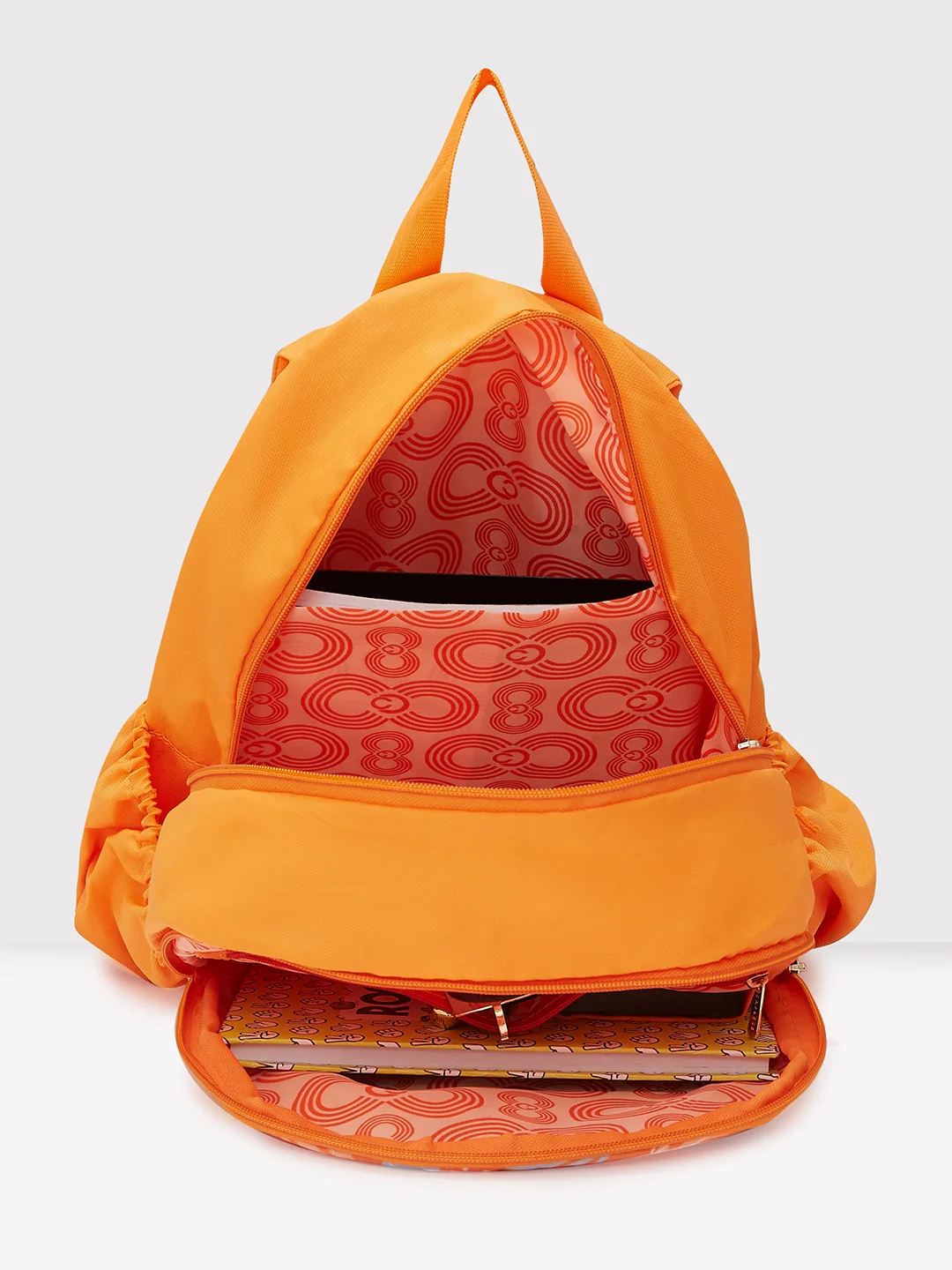 Caprese Xenia Medium Orange Printed Backpack - Image 10