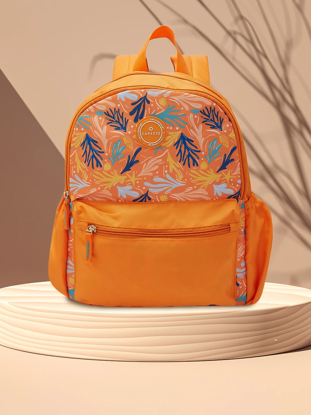 Caprese Xenia Medium Orange Printed Backpack - Image 11