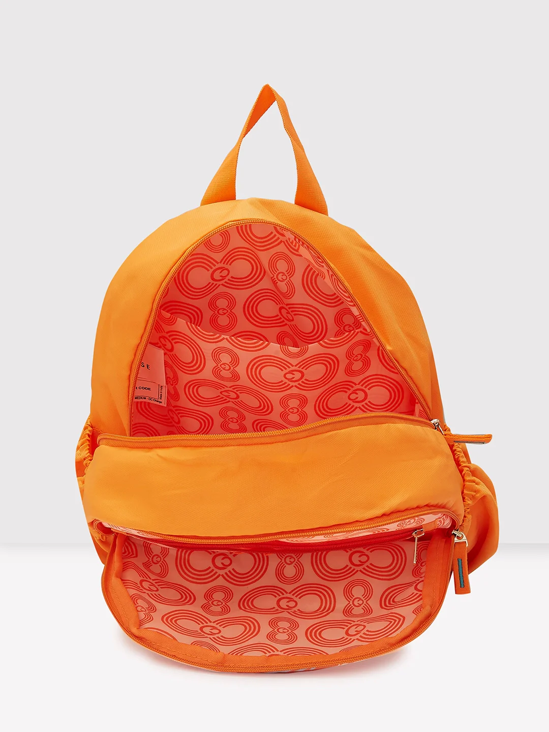 Caprese Xenia Medium Orange Printed Backpack - Image 4