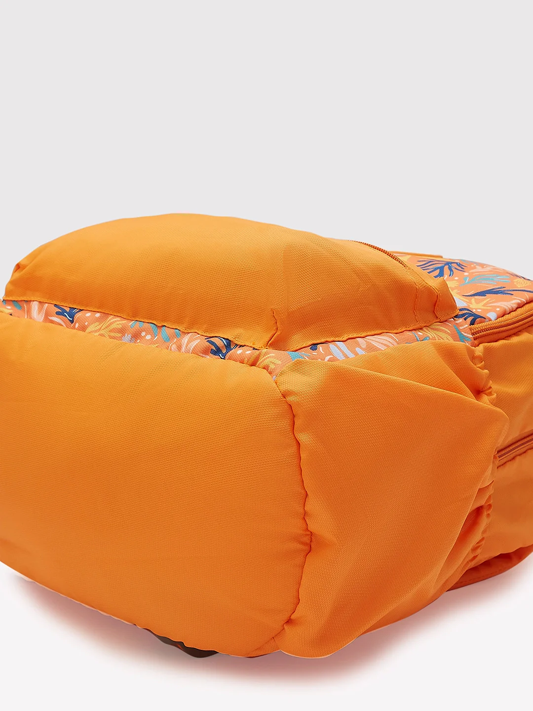 Caprese Xenia Medium Orange Printed Backpack - Image 9
