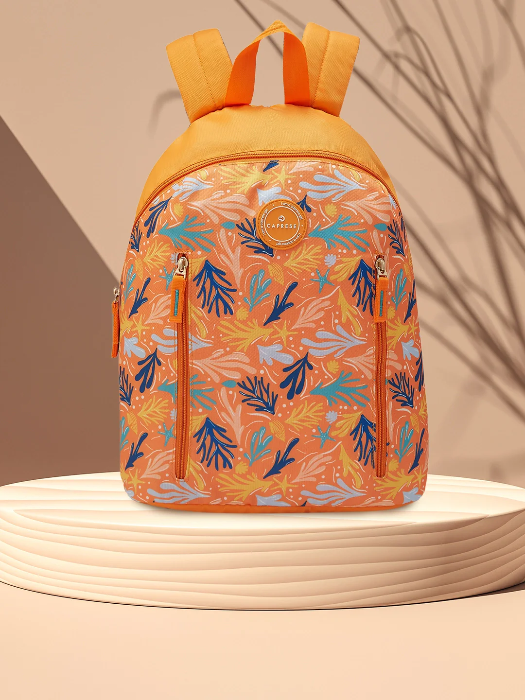 Caprese Xenia Medium Orange Printed Backpack - Image 11